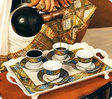 Eritrean coffee ceremony: coffee poured from a jebena into cups on a tray